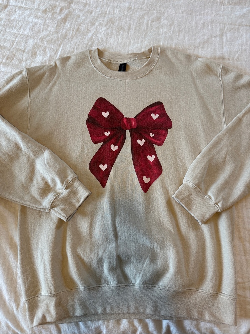 Tan Women’s Sweatshirt with Red Bow Graphic